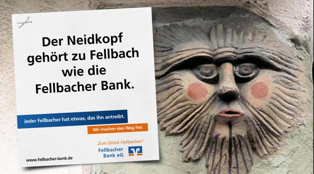 Großflächenmotiv der Fellbacher Bank mit dem Claim ‚Der Neidkopf gehört zu Fellbach wie die Fellbacher Bank‘ und einer Nahaufnahme des historischen Neidkopfs.